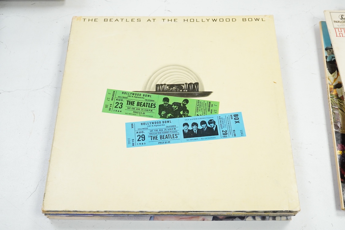 Fourteen LP record albums including eleven The Beatles and related; Sgt. Pepper’s Lonely Hearts Club Band (plus an additional three others), The Beatles at the Hollywood Bowl, Magical Mystery Tour, Revolver, etc., plus t